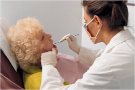 a dentist examining an elderly woman's mouth